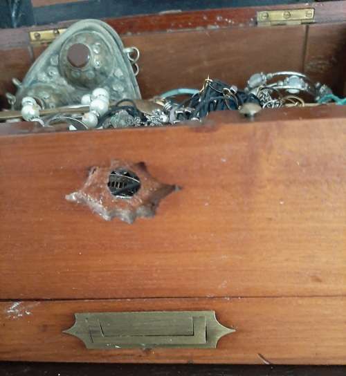 Wooden box with secret compartment filled with a mix or internation coins and costume jewellery